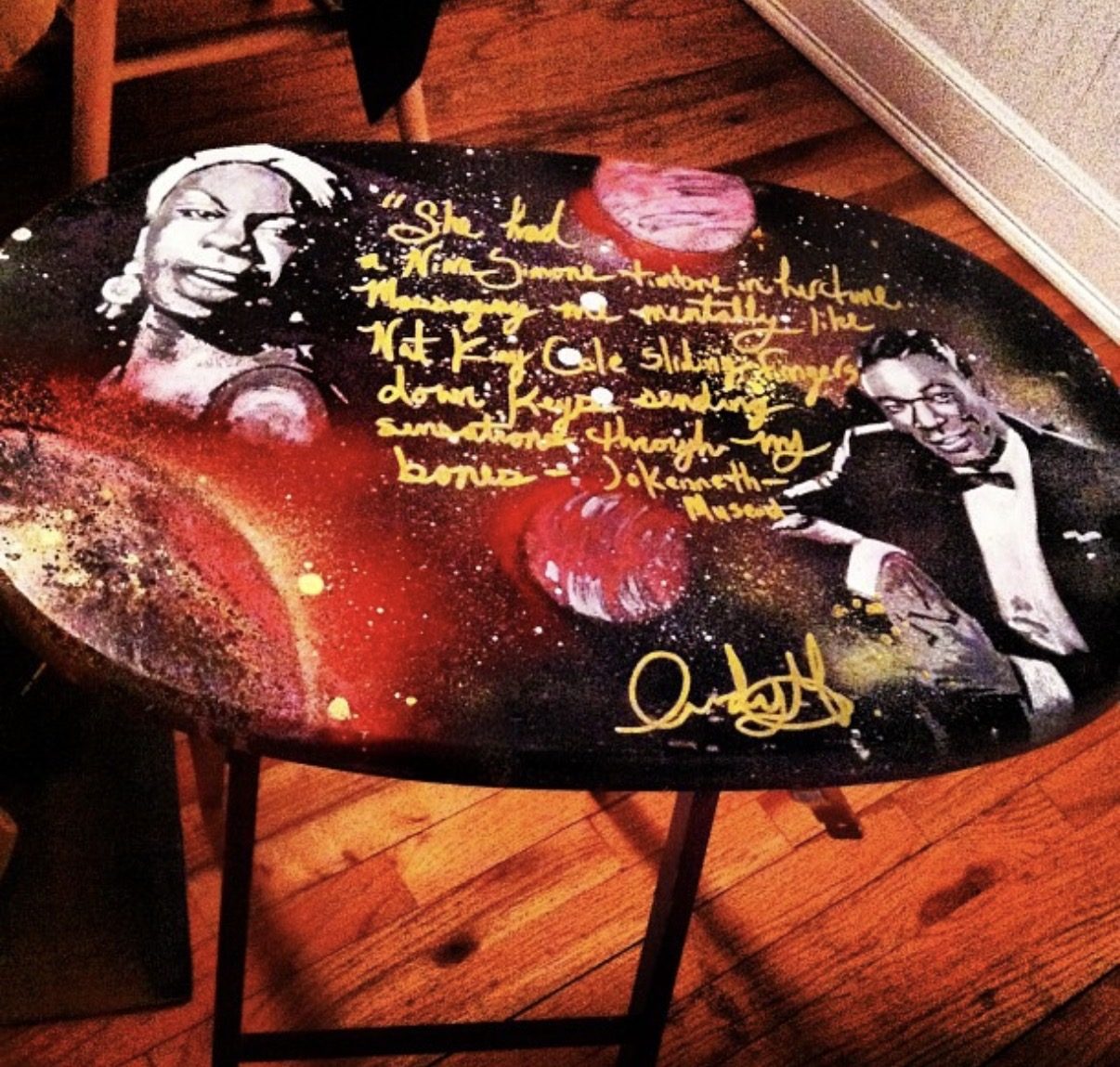 Nina Simone and Nat King Cole hand-painted with gold lettering on a round table top by Andres Gallardo