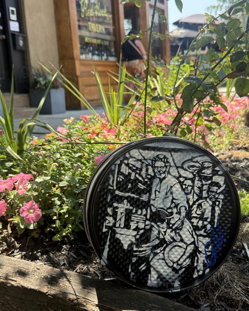 A GEM Movement record piece hidden among flowers, waiting to be found