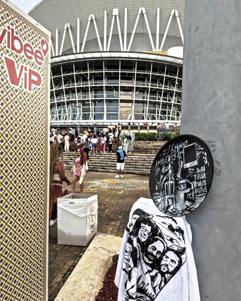 A GEM Movement record piece and a printed shirt on a wall outside an arena, Puerto Rico
