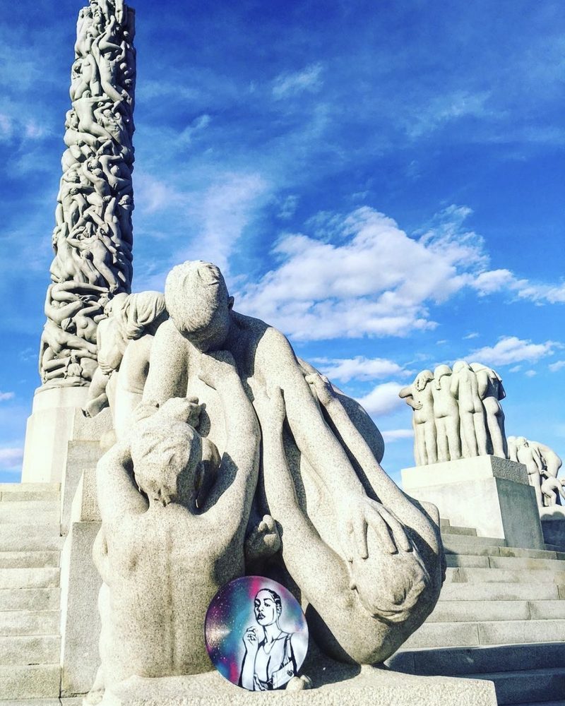 A GEM Movement record piece at the feet of a stone sculpture in Vigeland Park, Oslo
