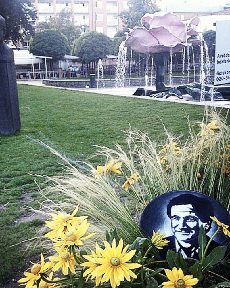 A GEM Movement record piece among yellow flowers in a park in Sweden